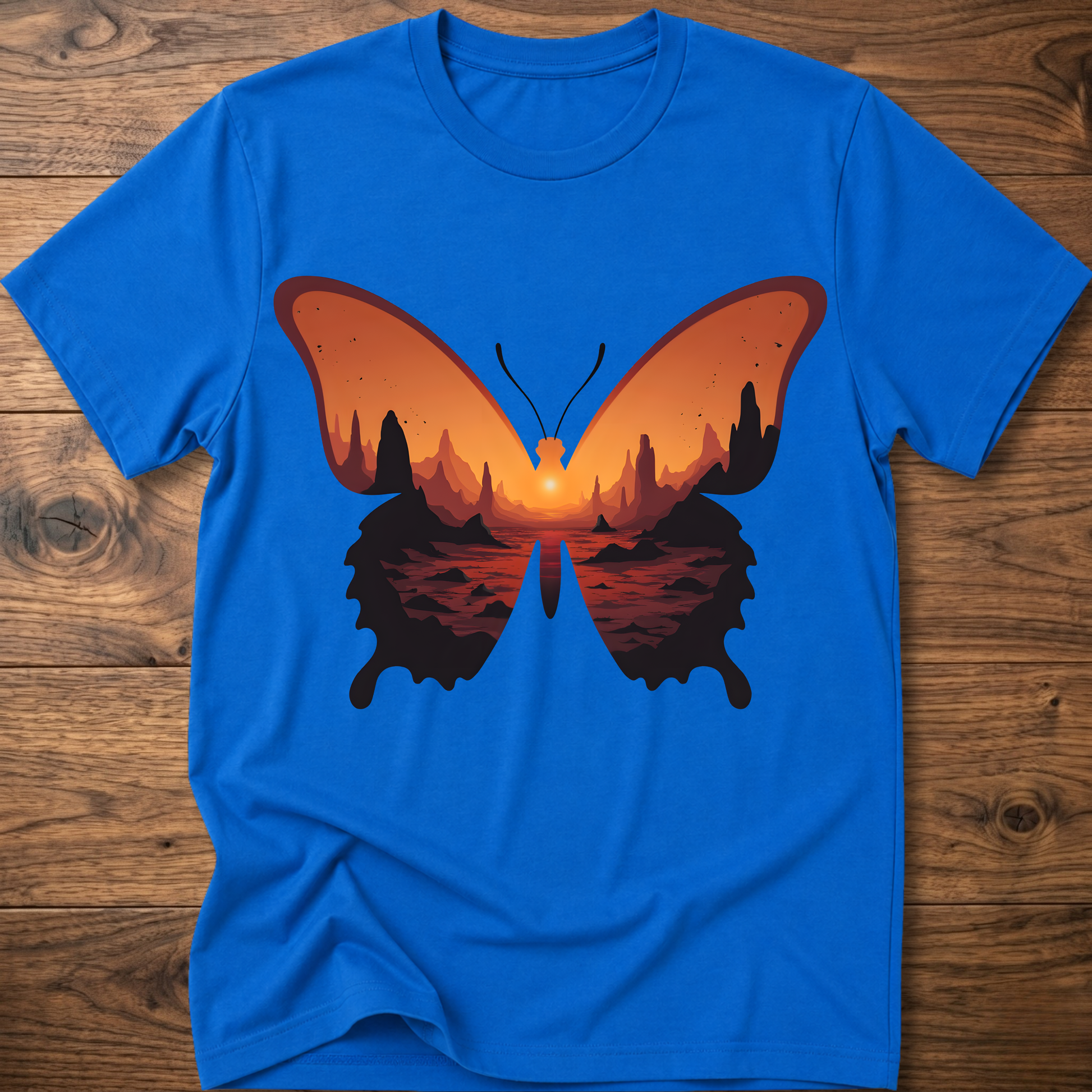 Royal blue crew-neck T-shirt with colorful butterfly graphic in orange and black