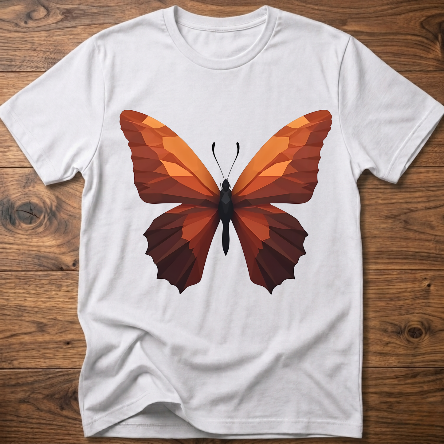 White T-shirt with geometric butterfly graphic, orange and brown wings on front.
