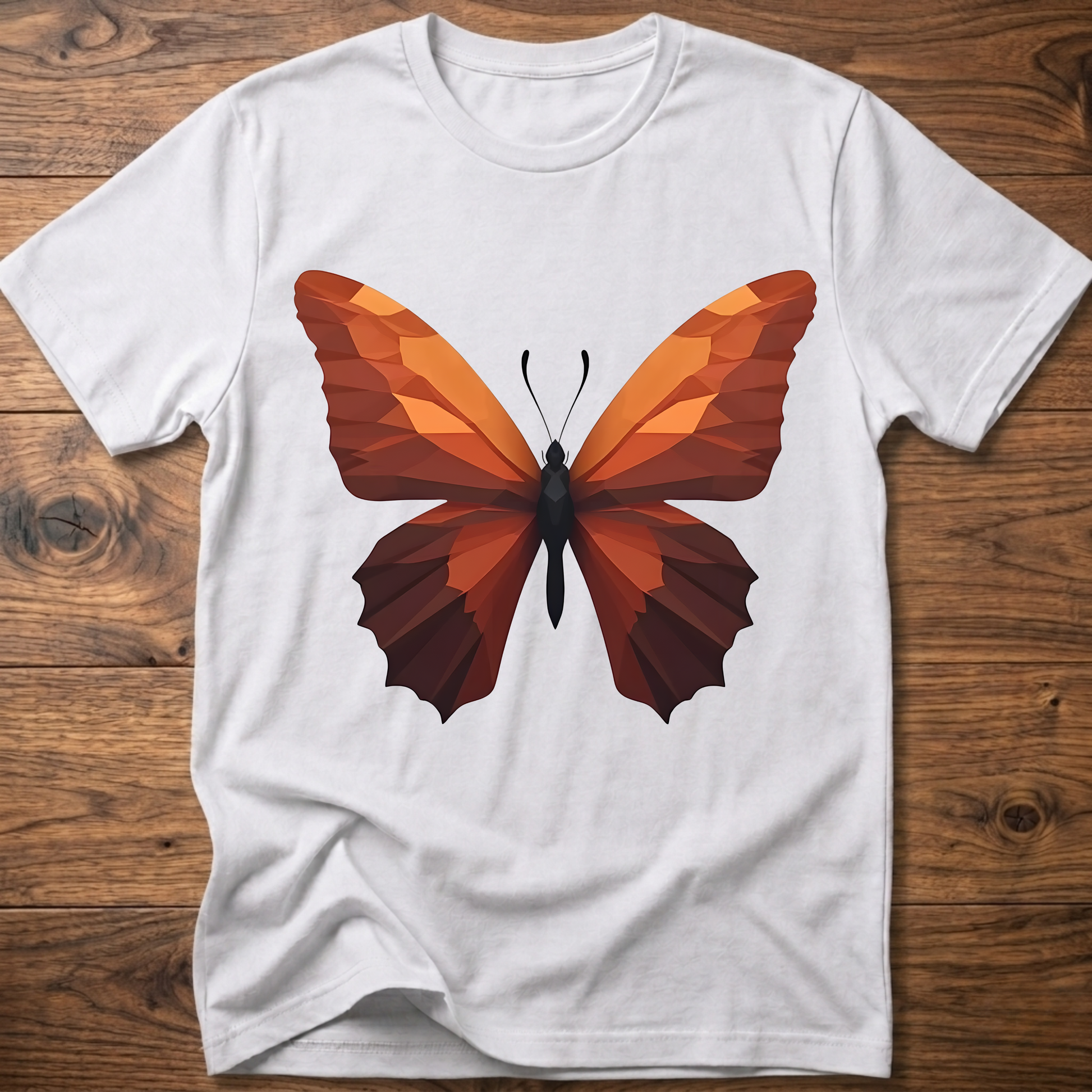 White T-shirt with geometric butterfly graphic, orange and brown wings on front.