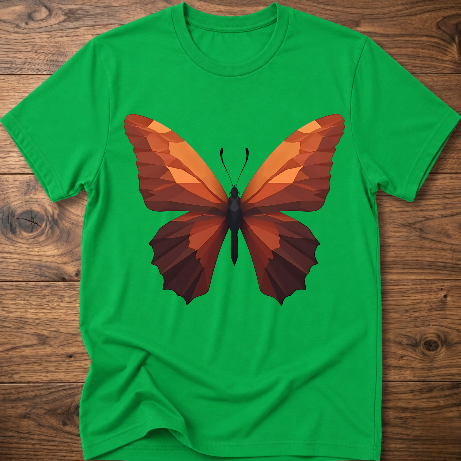 Daisy green T-shirt with geometric butterfly graphic, orange and brown wings on front.