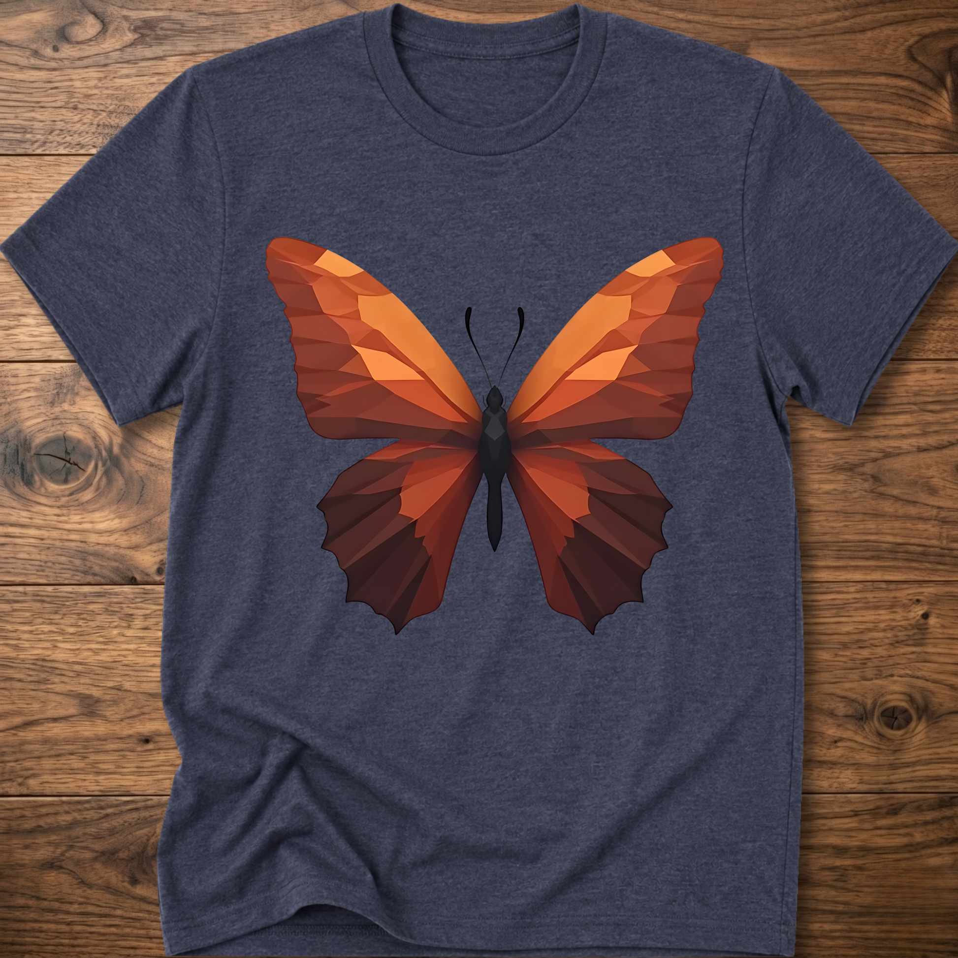Dark heather navy T-shirt with geometric butterfly graphic, orange and brown wings on front.