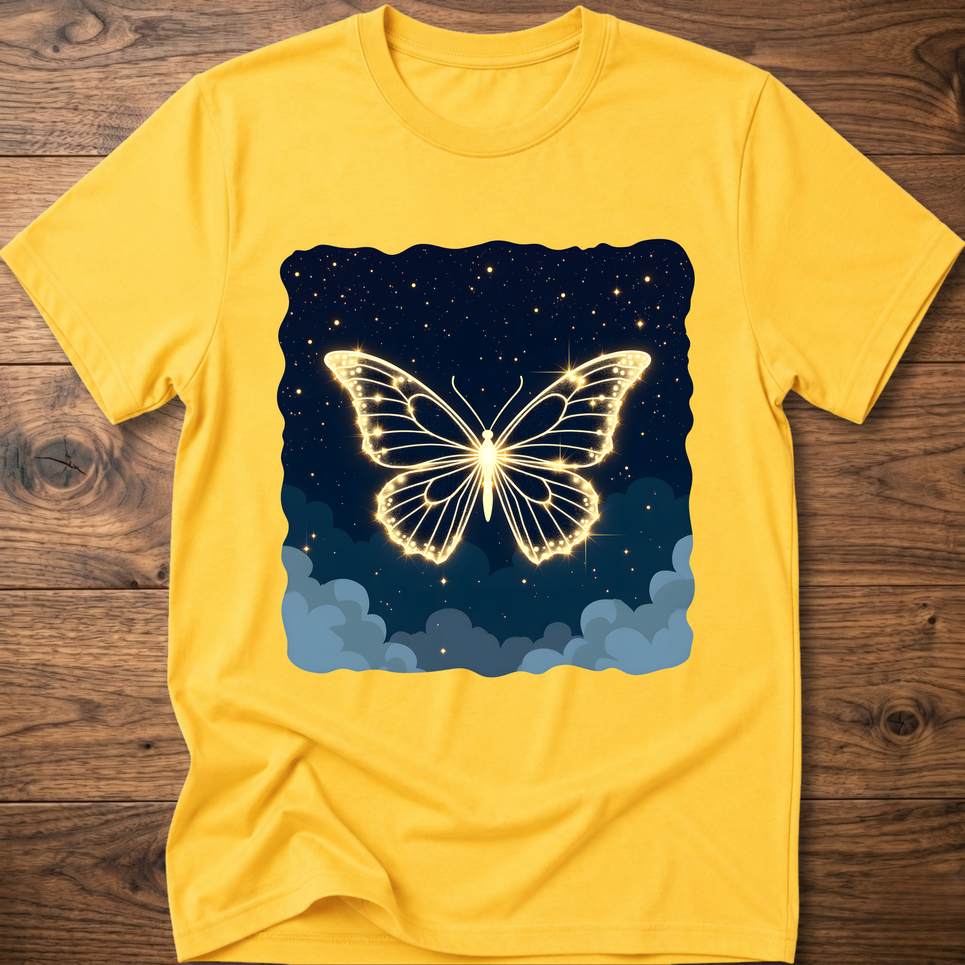 Yellow T-shirt with glowing butterfly graphic over starry night and clouds