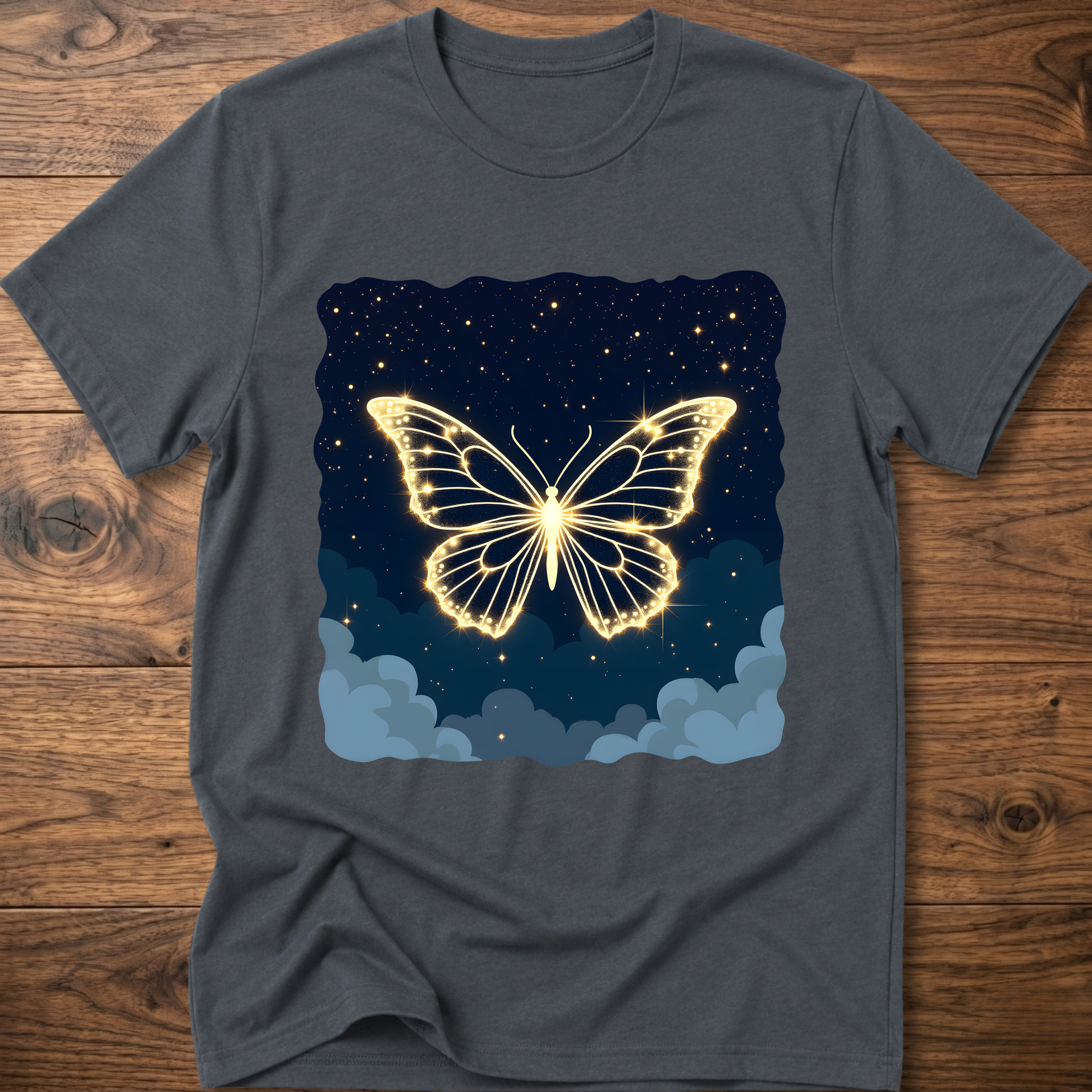 Gray-blue T-shirt with glowing butterfly graphic over starry night and clouds