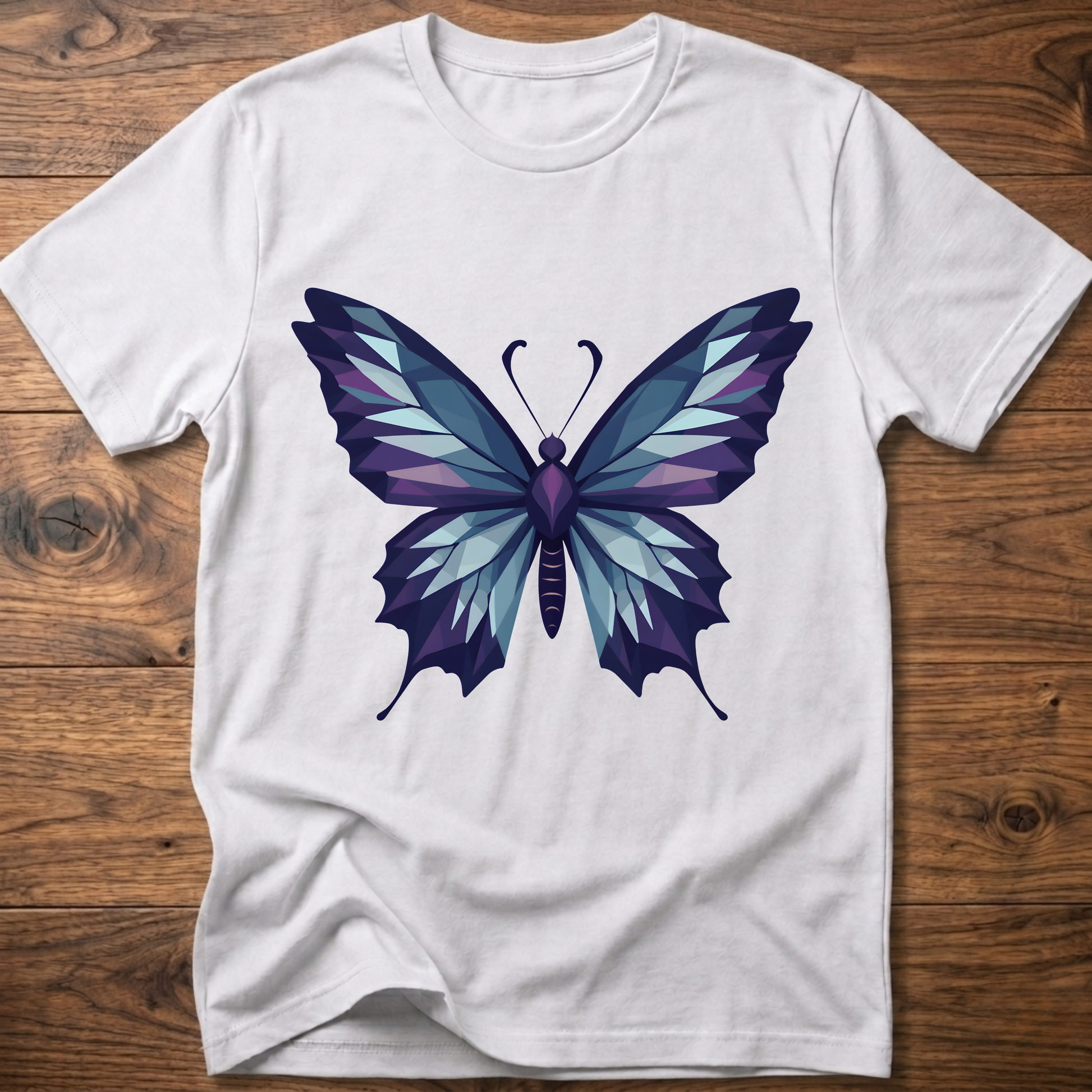 White t-shirt with geometric butterfly graphic in blue and purple, crew neck.