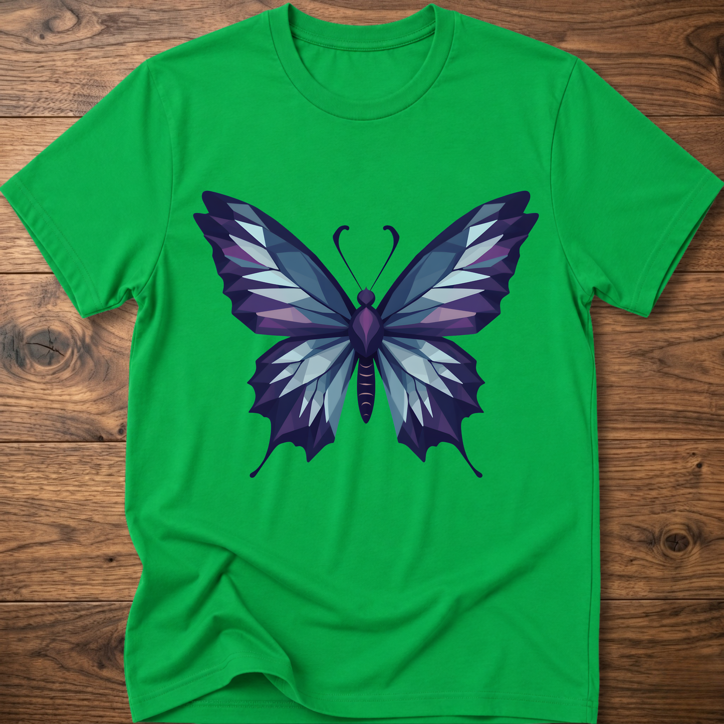 Green t-shirt with geometric butterfly graphic in blue and purple, crew neck.