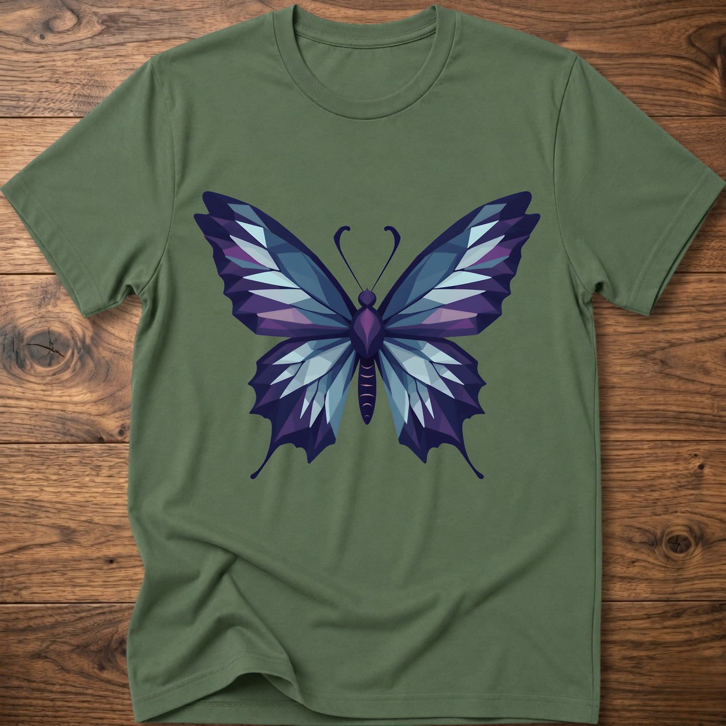 Olive green t-shirt with geometric butterfly graphic in blue and purple, crew neck.