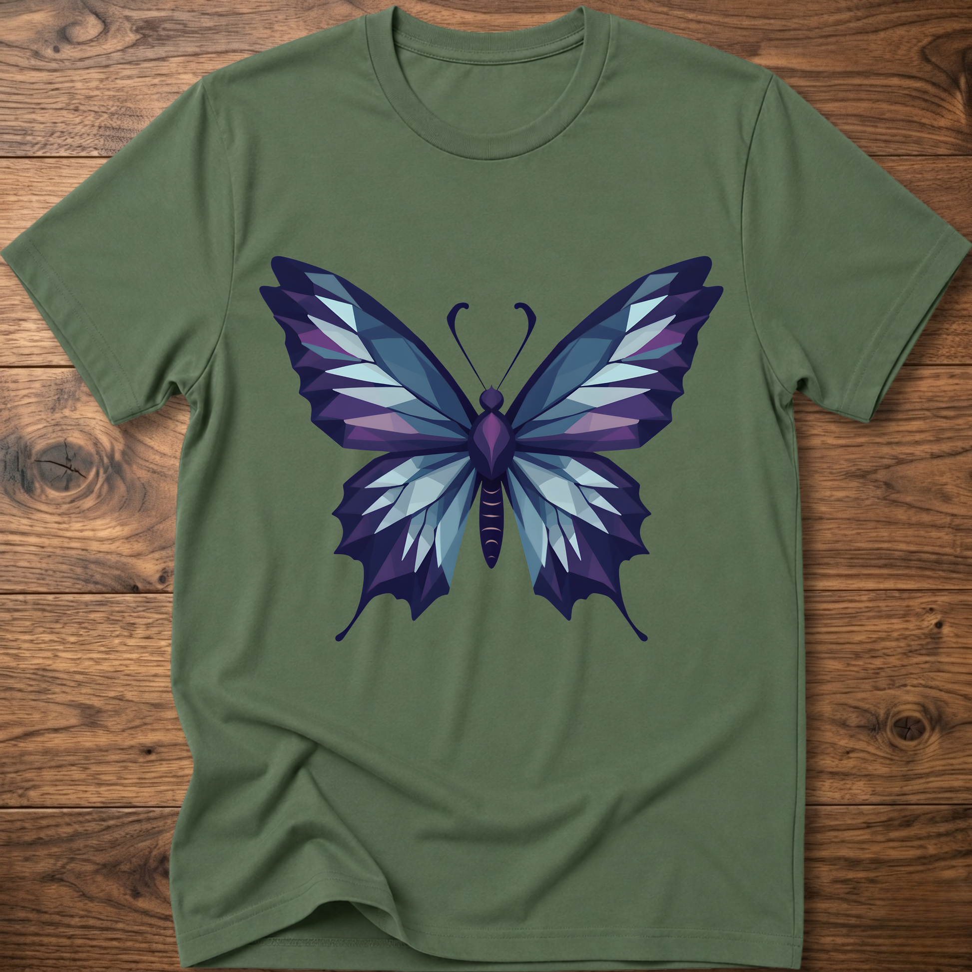 Olive green t-shirt with geometric butterfly graphic in blue and purple, crew neck.