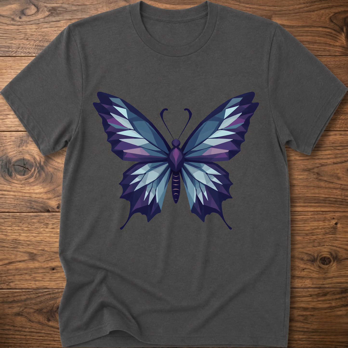 Dark gray t-shirt with geometric butterfly graphic in blue and purple, crew neck.