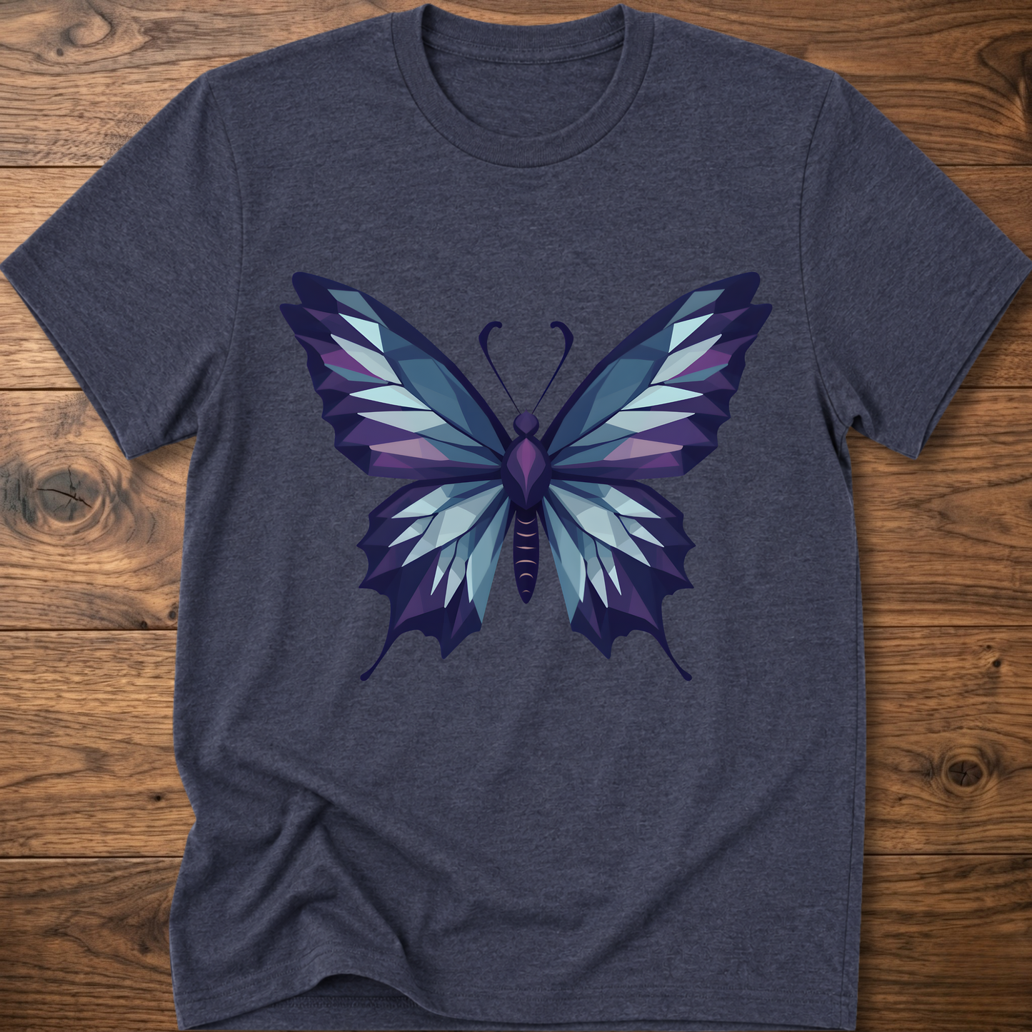 Navy blue t-shirt with geometric butterfly graphic in blue and purple, crew neck.