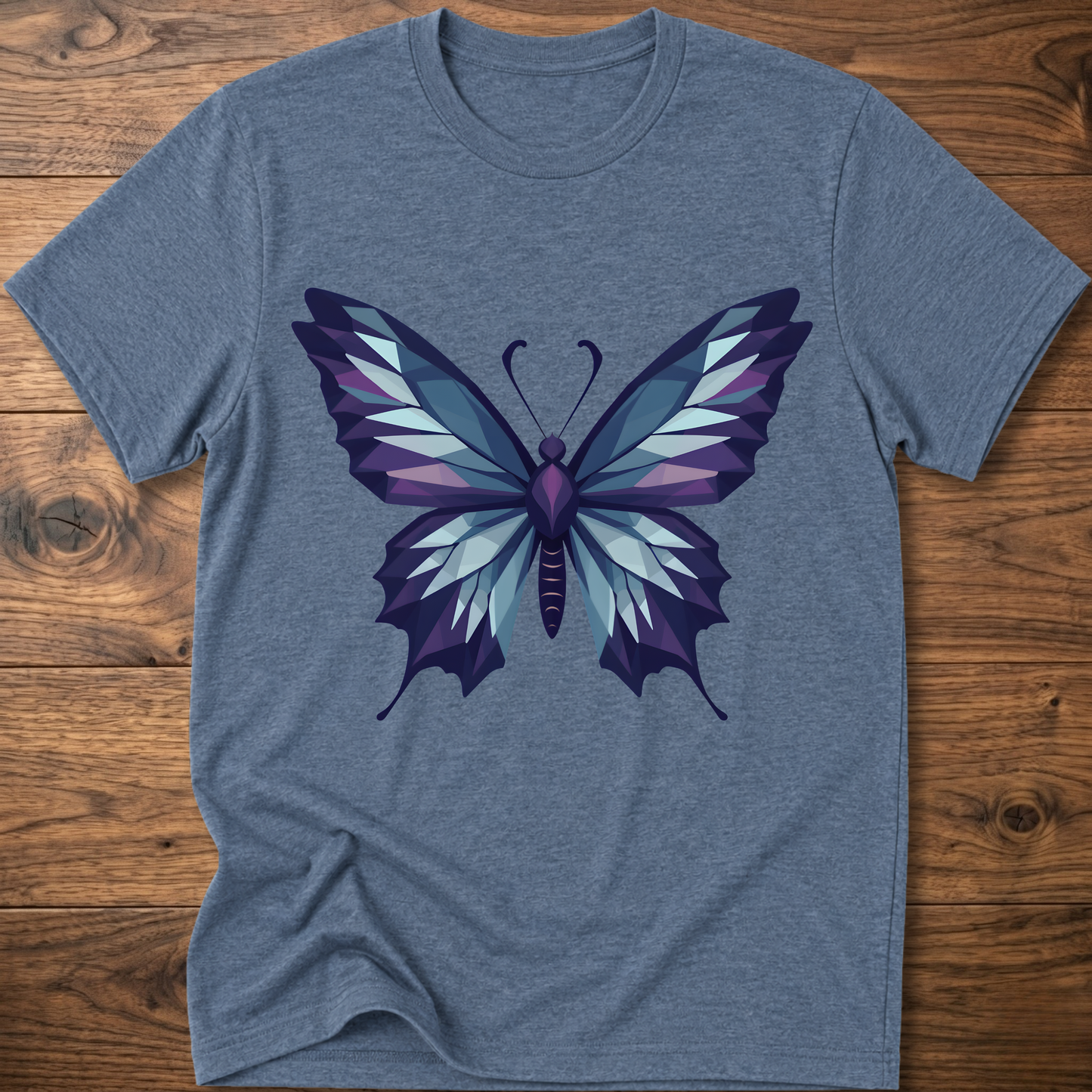 Heather blue t-shirt with geometric butterfly graphic in blue and purple, crew neck.