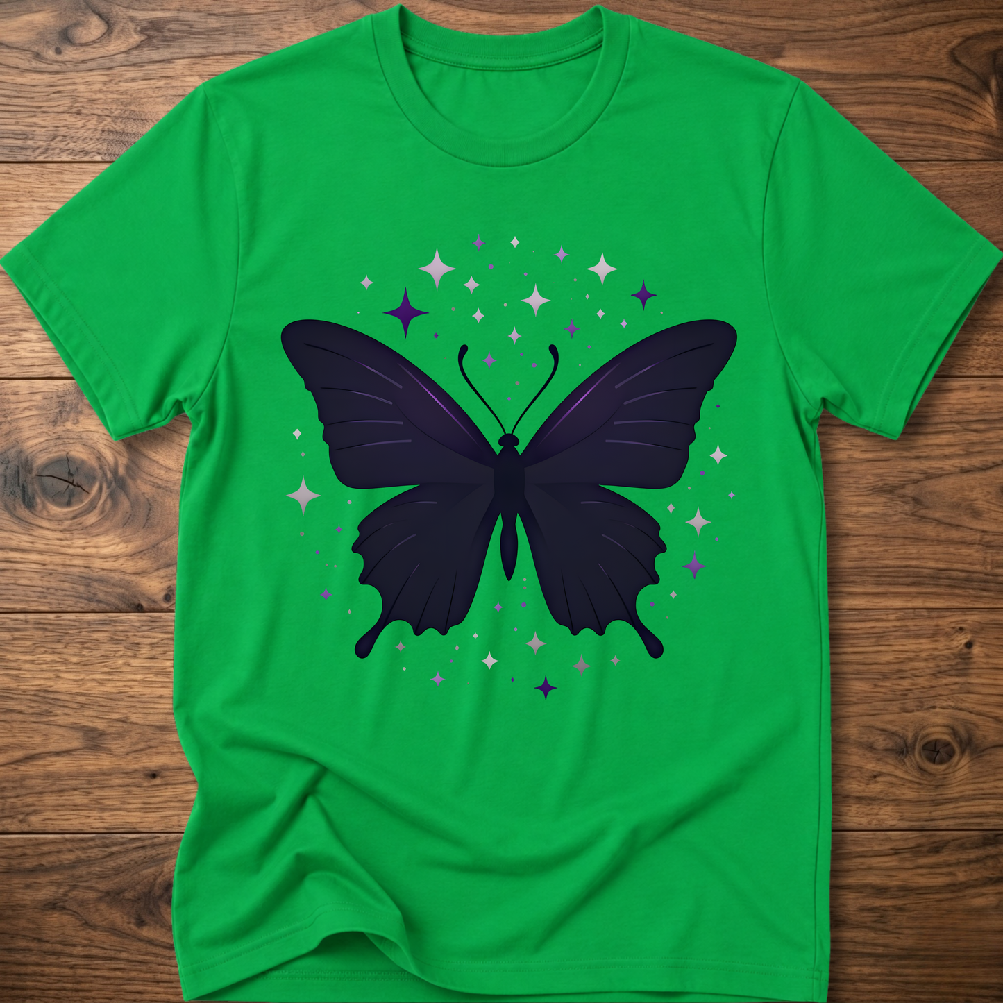 Green T-shirt with dark butterfly star graphic in purple and gray