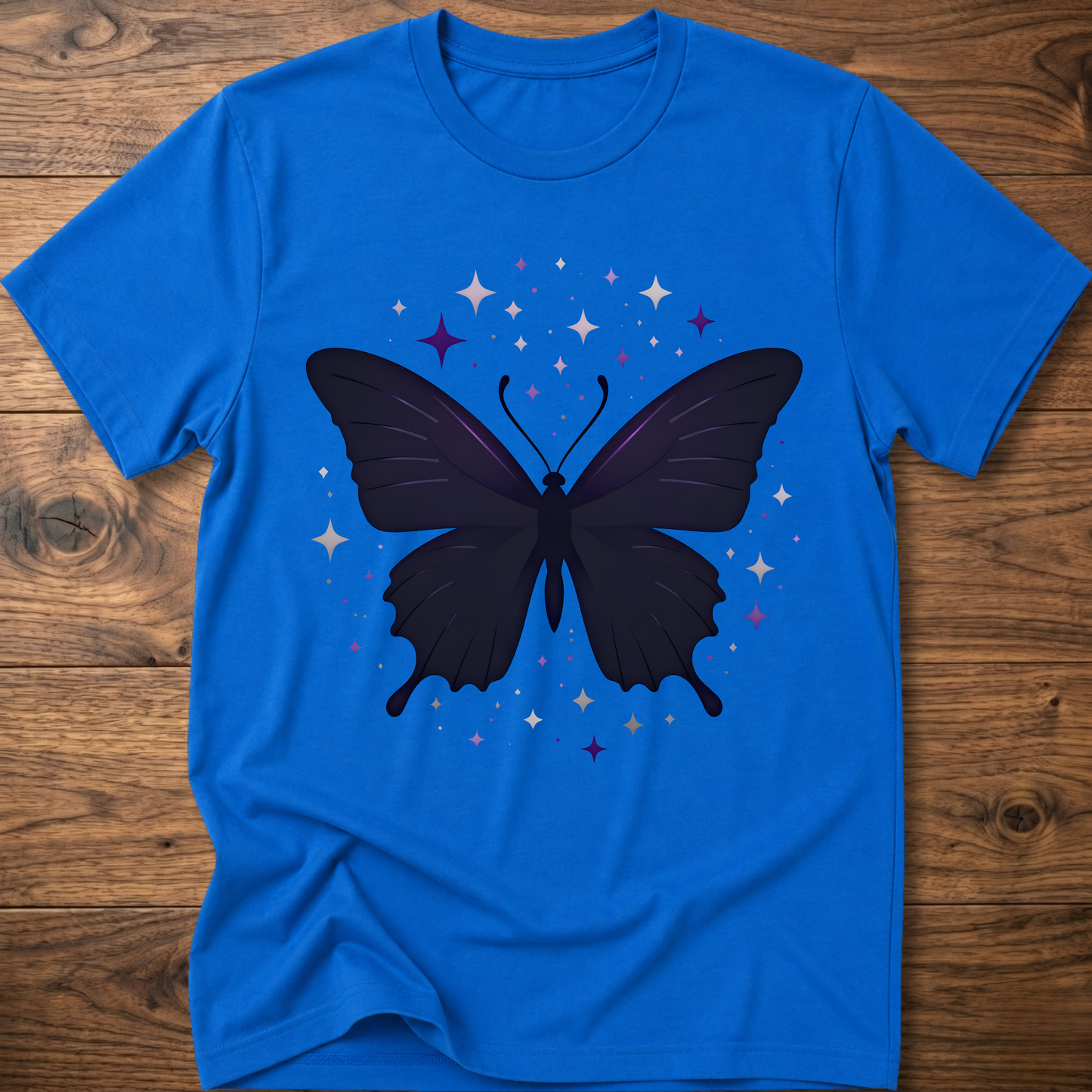 Royal blue T-shirt with dark butterfly star graphic in purple and gray