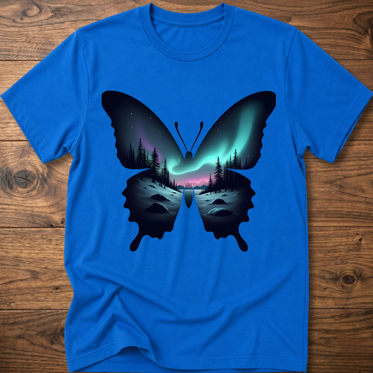 Royal blue T-shirt with dark butterfly graphic and glowing forest aurora print