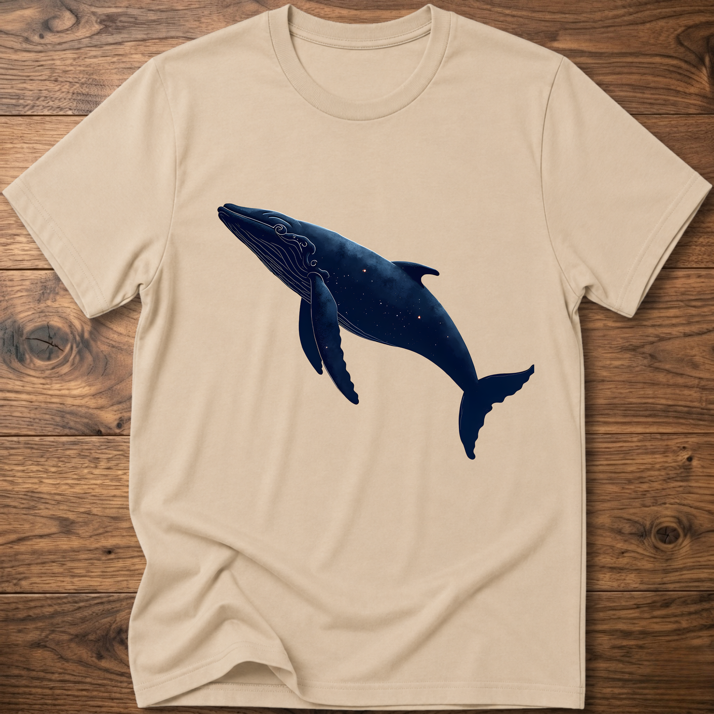 Beige whale graphic T-shirt with dark blue printed whale on the chest