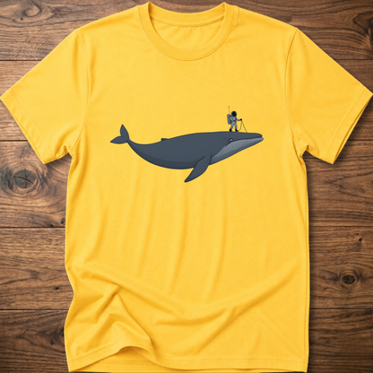 Yellow astronaut whale T-shirt with graphic whale and astronaut standing on back fin