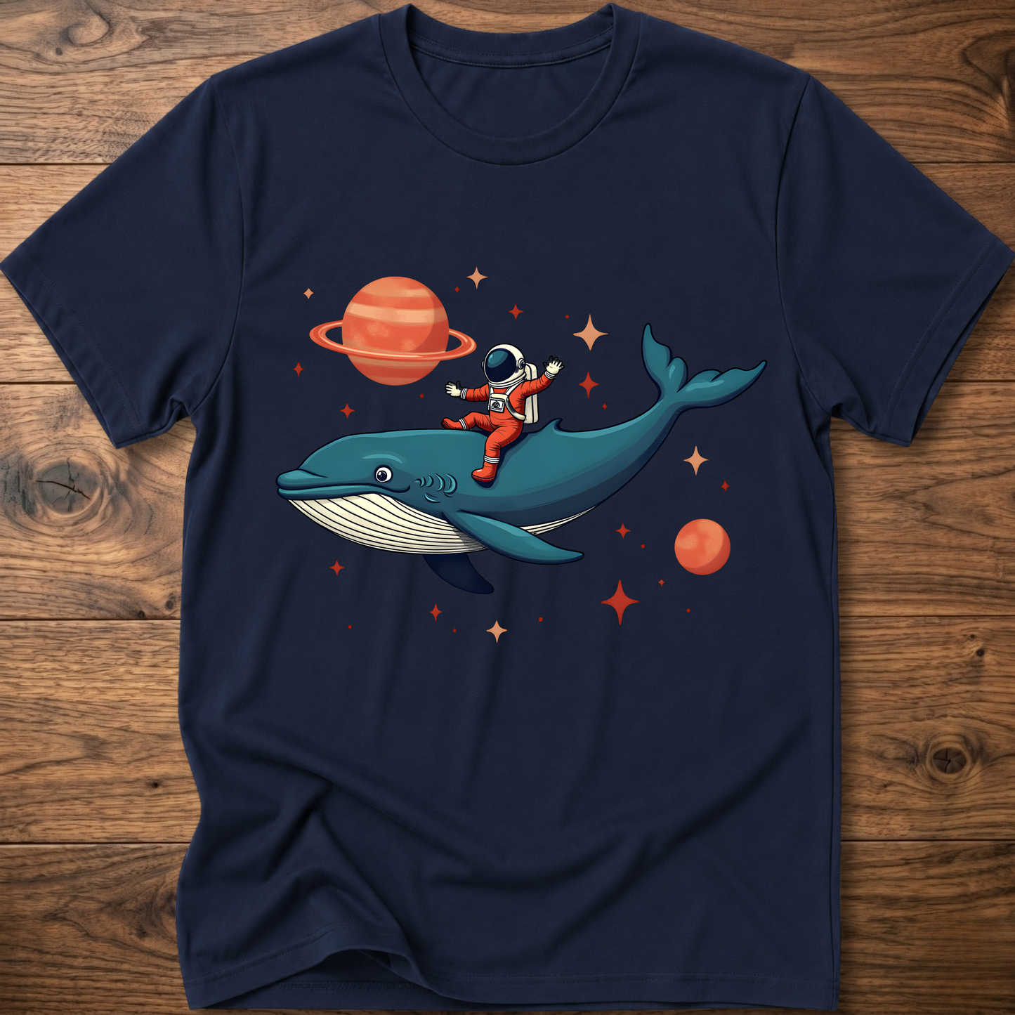 Navy astronaut and whale space-themed t-shirt with colorful front graphic