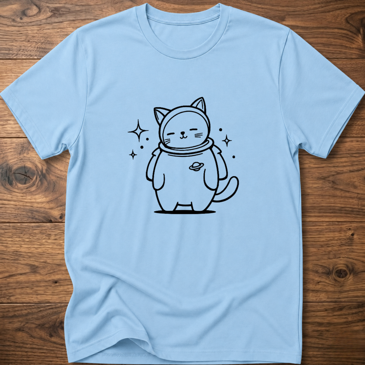 Light blue crew-neck T-shirt with astronaut cat graphic on the front