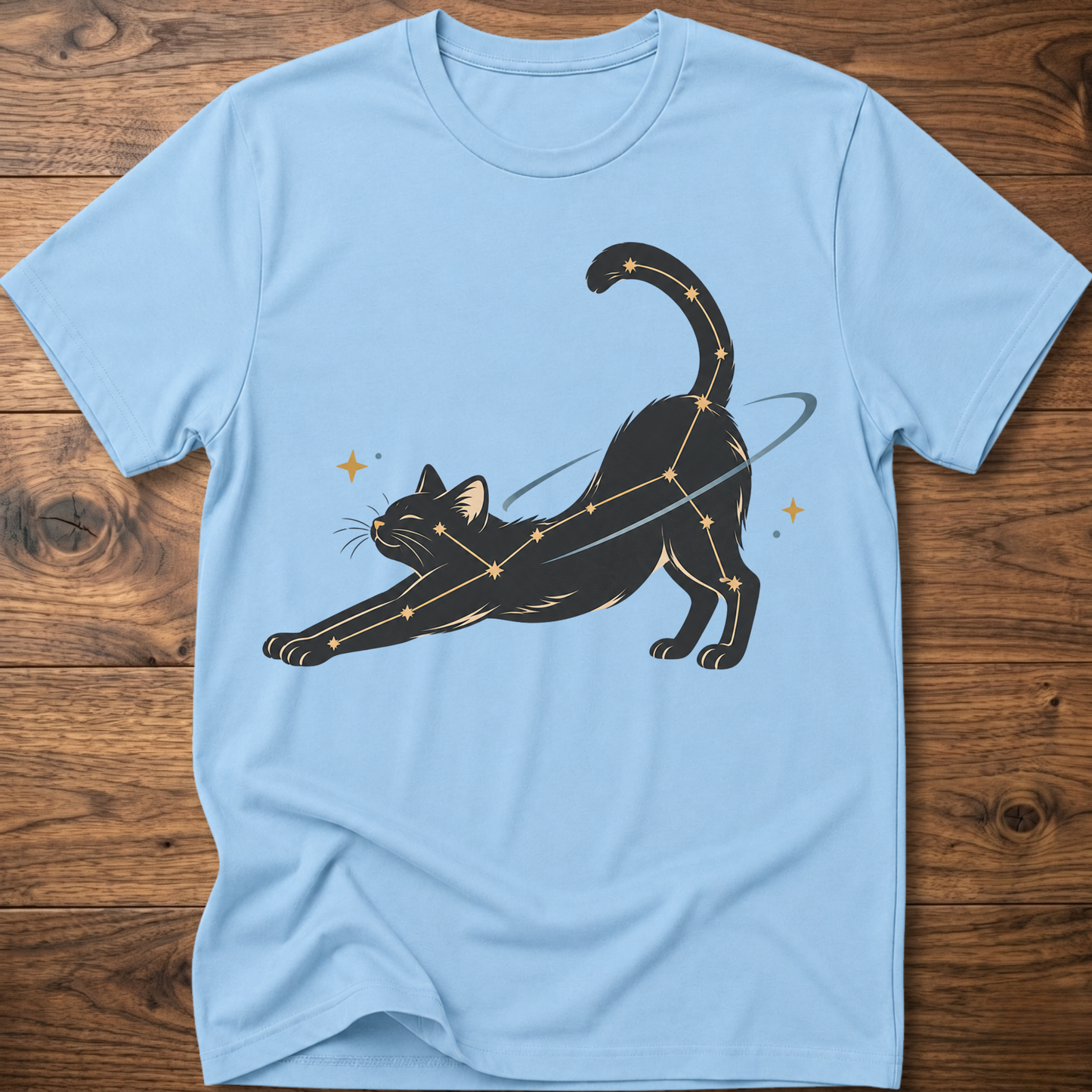 Light blue cat constellation T-shirt with illustrated cat and star accents holding a wand