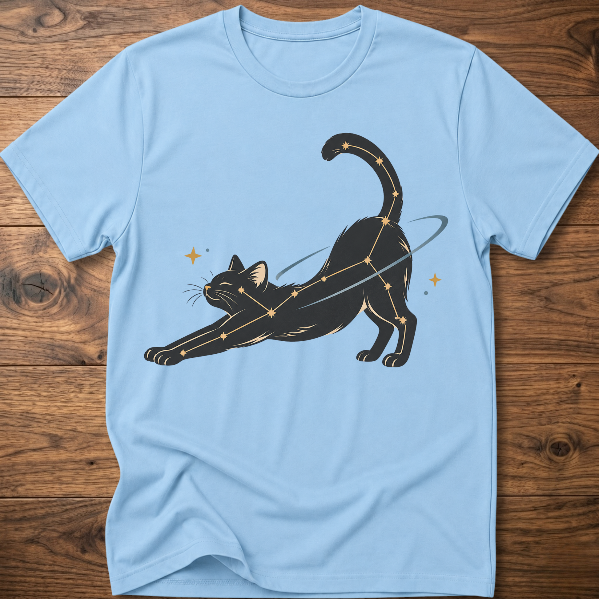 Light blue cat constellation T-shirt with illustrated cat and star accents holding a wand