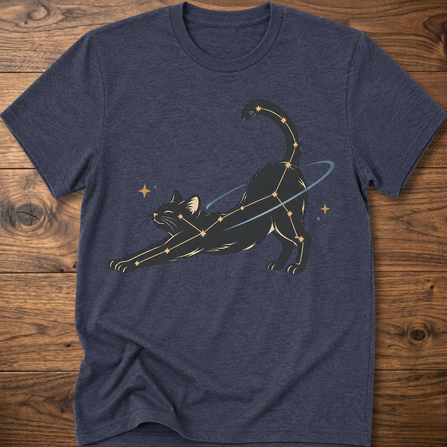 Heather navy cat constellation T-shirt with illustrated cat and star accents holding a wand