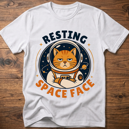 White cat astronaut graphic t-shirt with circular helmet design and orange text