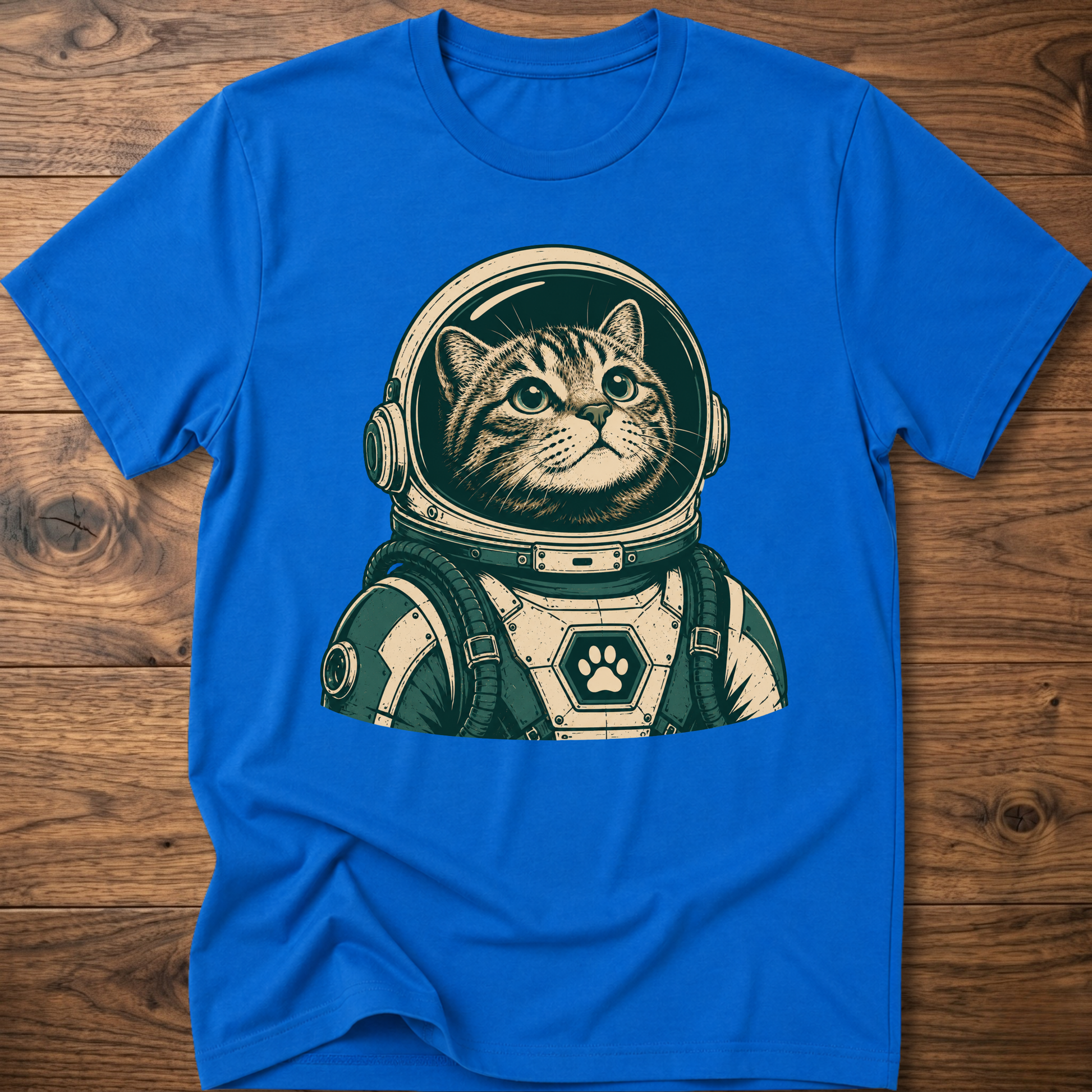 Royal blue short-sleeve t-shirt with retro astronaut cat graphic on front