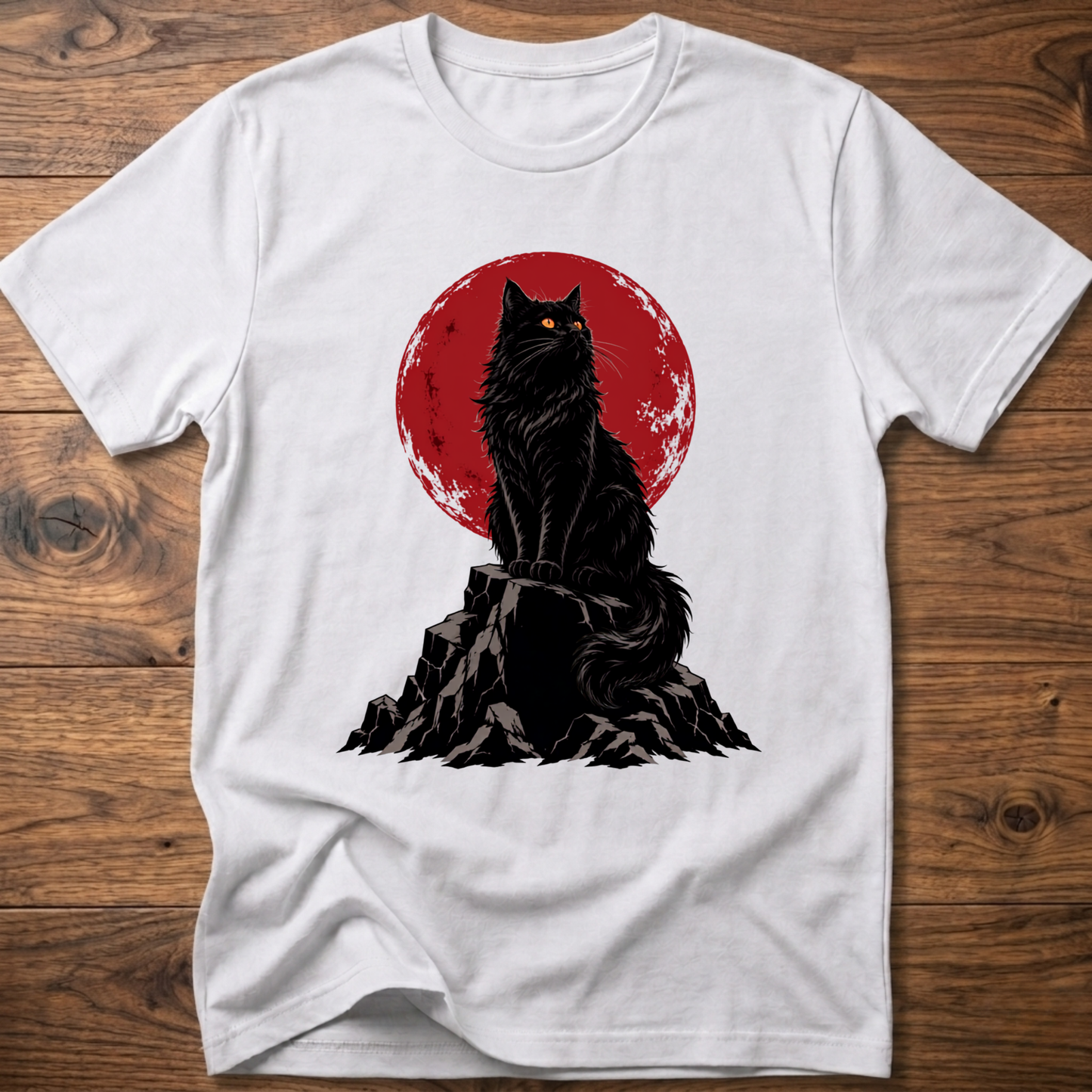 White t-shirt with black cat graphic on rocky ground inside red circle.