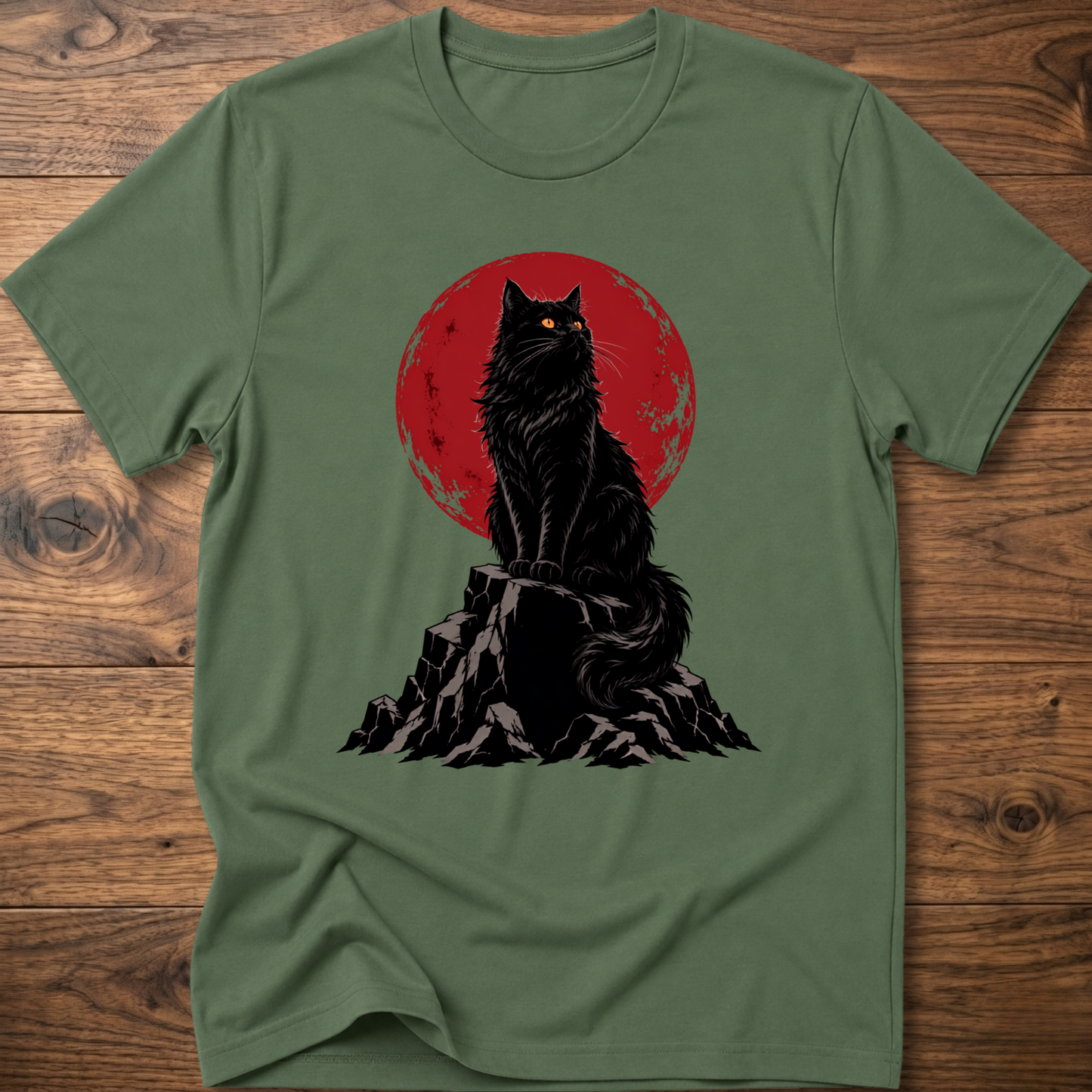 Military green t-shirt with black cat graphic on rocky ground inside red circle.