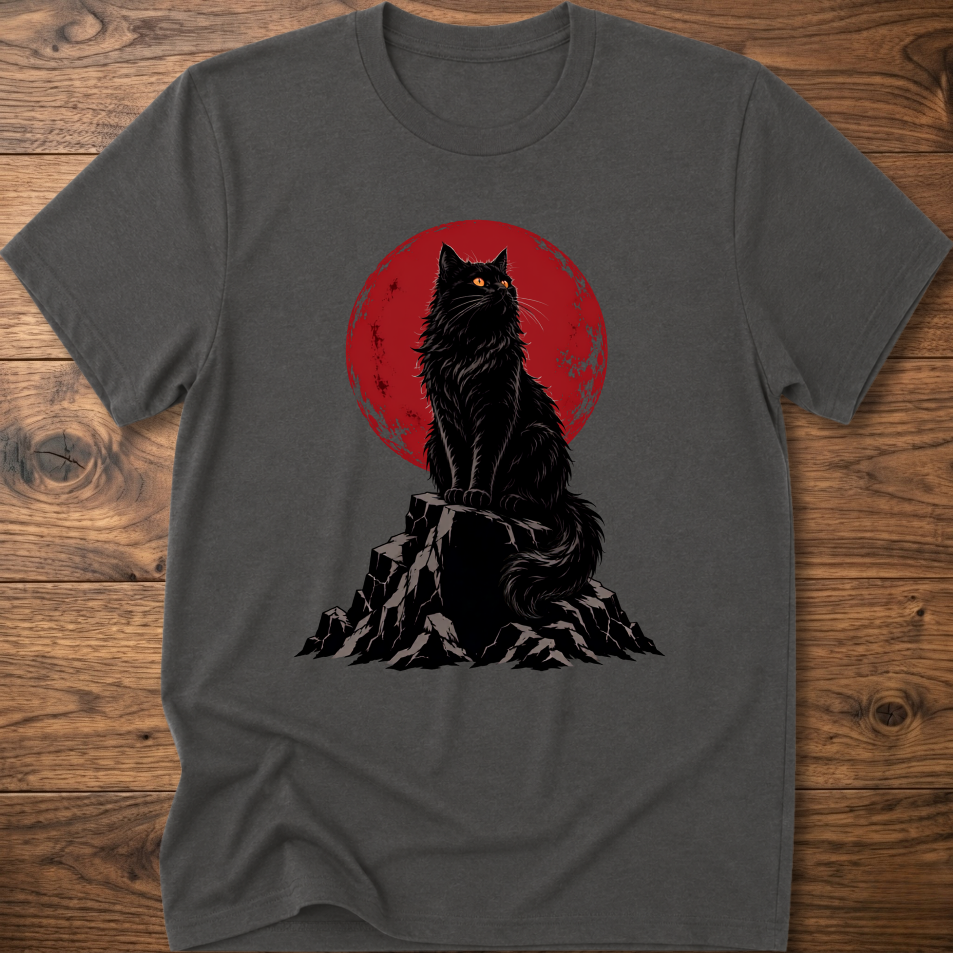 Charcoal gray t-shirt with black cat graphic on rocky ground inside red circle.