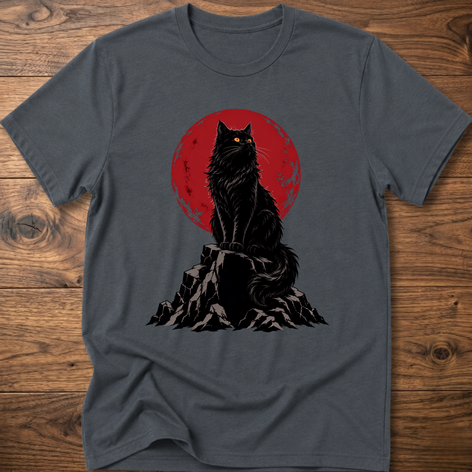 Dark gray t-shirt with black cat graphic on rocky ground inside red circle.