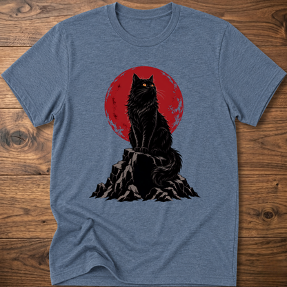 Heathered blue t-shirt with black cat graphic on rocky ground inside red circle.