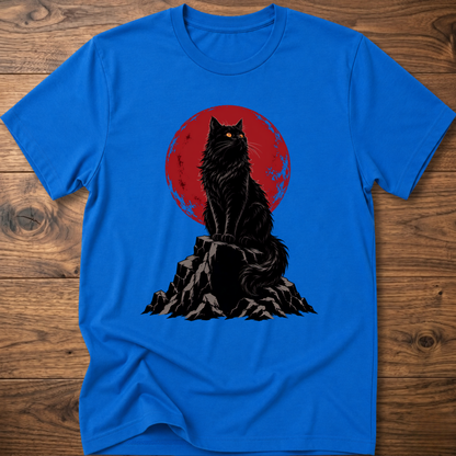 Royal blue t-shirt with black cat graphic on rocky ground inside red circle.