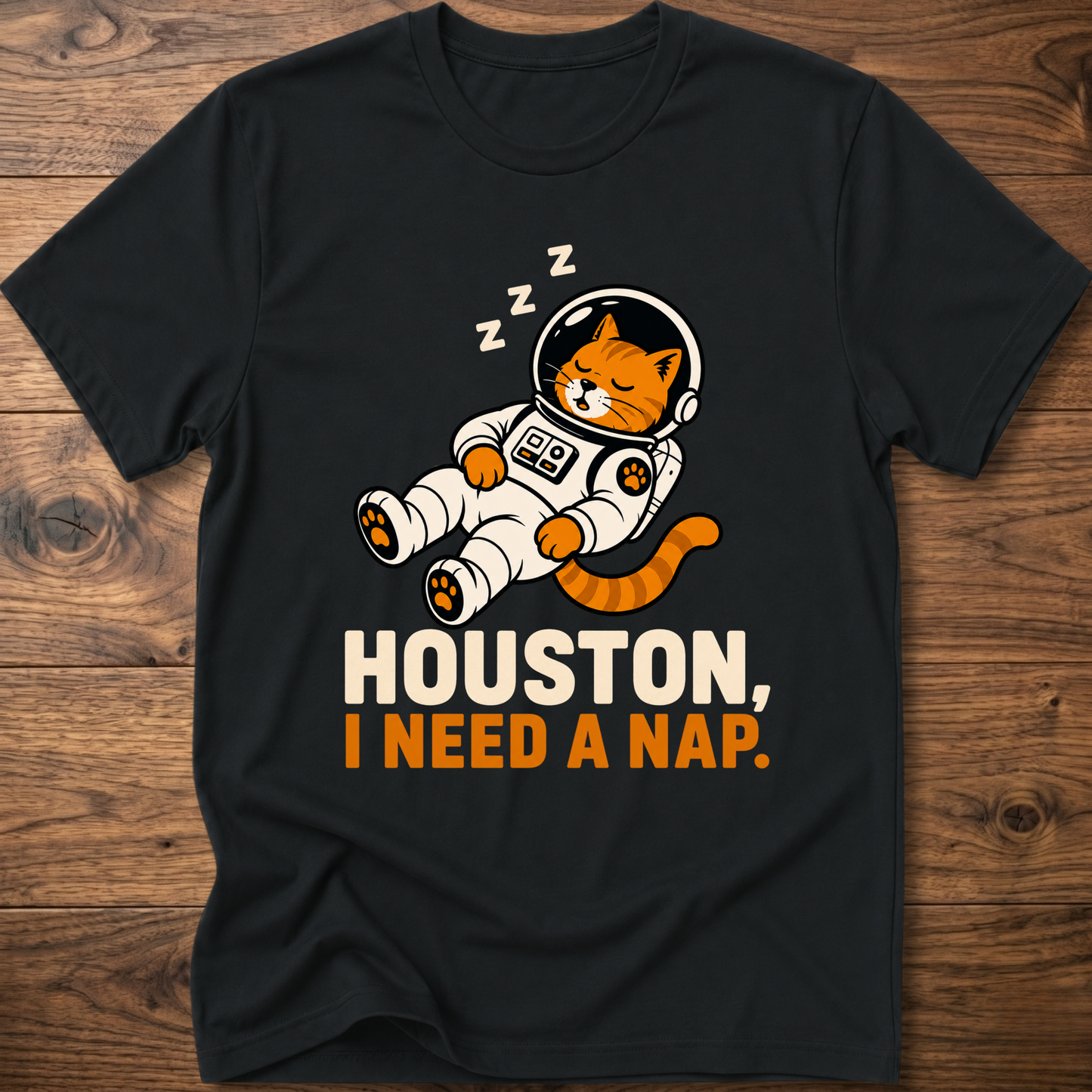 Black crew-neck T-shirt with cat astronaut graphic: HOUSTON, I NEED A NAP.