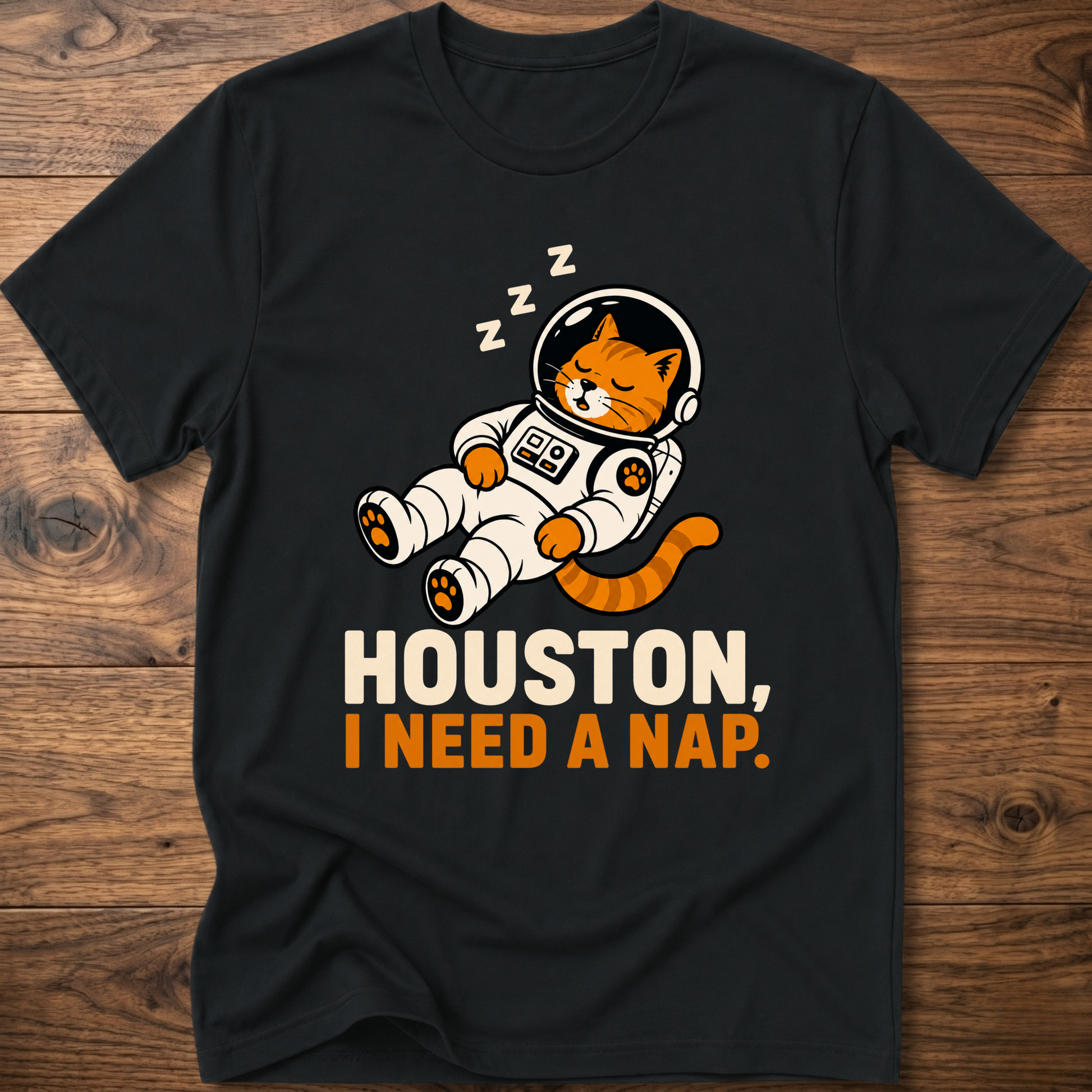 Black crew-neck T-shirt with cat astronaut graphic: HOUSTON, I NEED A NAP.