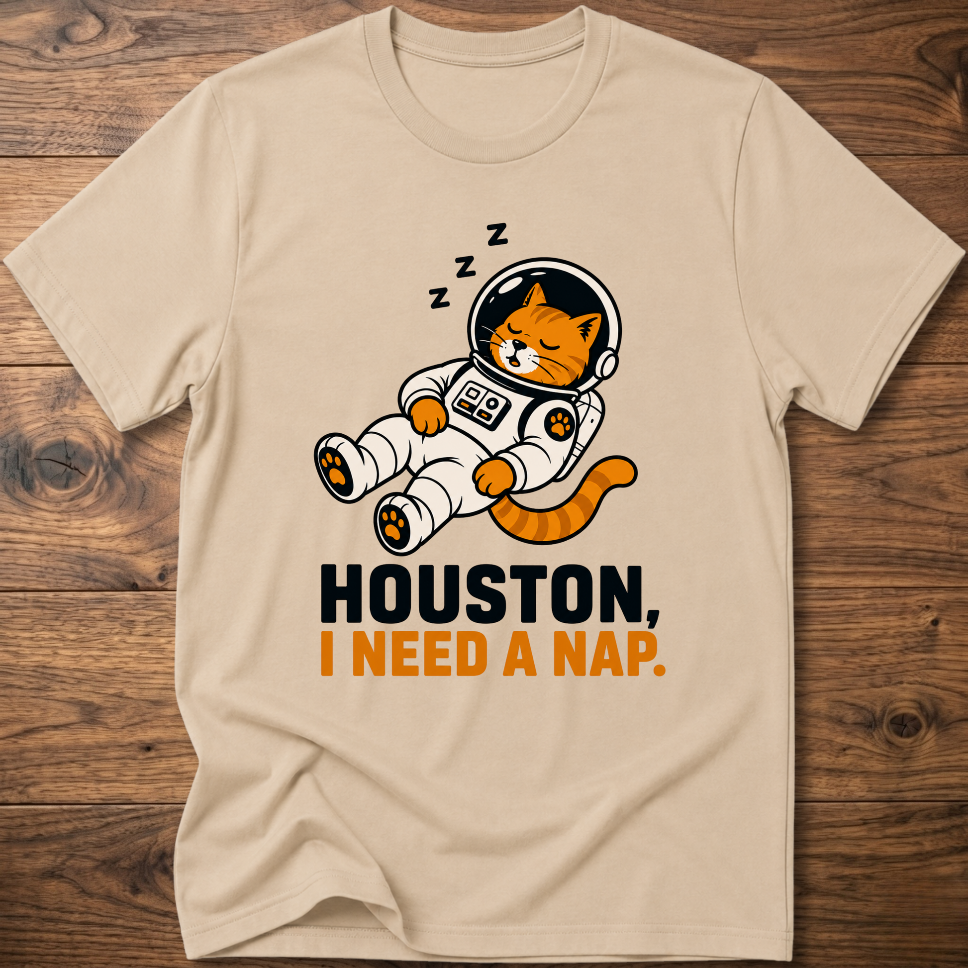 Sand beige crew-neck T-shirt with cat astronaut graphic: HOUSTON, I NEED A NAP.