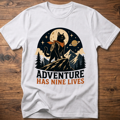 White cat graphic t-shirt, moonlit cat on mountains with 'Adventure Has Nine Lives'