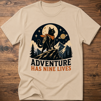 Sand cat graphic t-shirt, moonlit cat on mountains with 'Adventure Has Nine Lives'