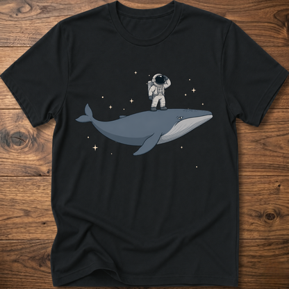 Black short-sleeve t-shirt with astronaut riding a whale graphic and star accents