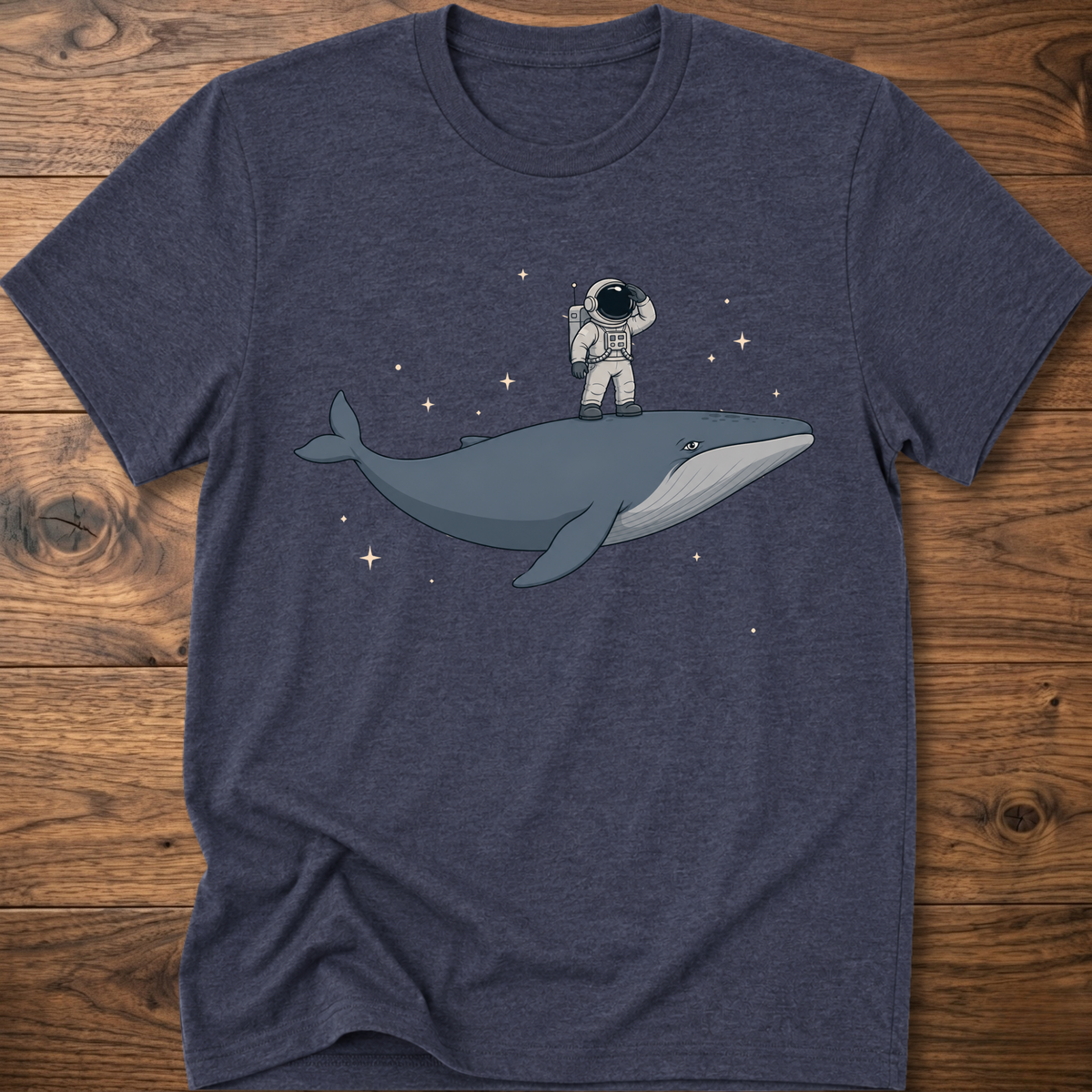 Heather navy short-sleeve t-shirt with astronaut riding a whale graphic and star accents