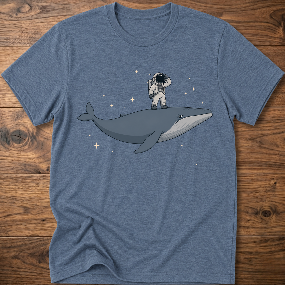 Heather indigo short-sleeve t-shirt with astronaut riding a whale graphic and star accents