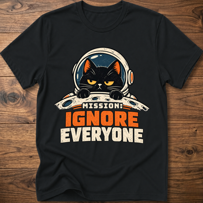 Black T-shirt with cat astronaut 'Mission Ignore Everyone' graphic.