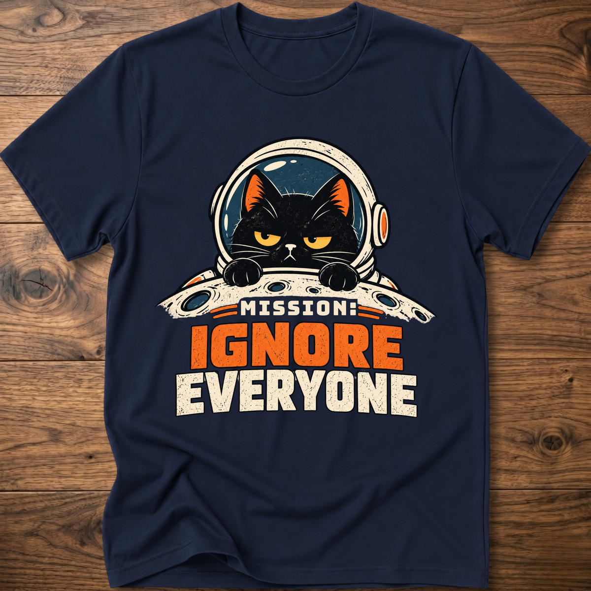 Navy T-shirt with cat astronaut 'Mission Ignore Everyone' graphic.