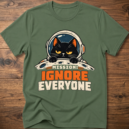 Military green T-shirt with cat astronaut 'Mission Ignore Everyone' graphic.