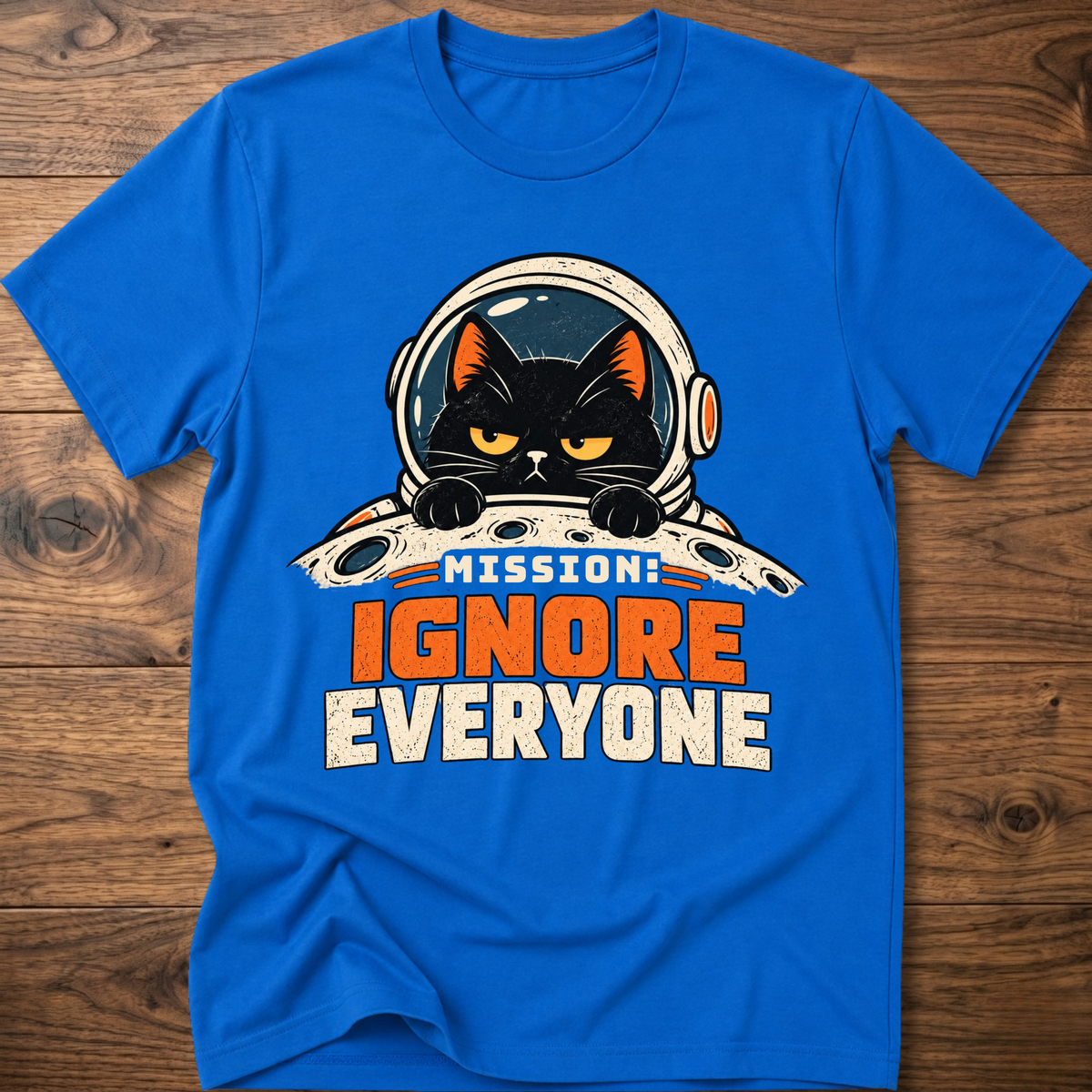 Royal blue T-shirt with cat astronaut 'Mission Ignore Everyone' graphic.