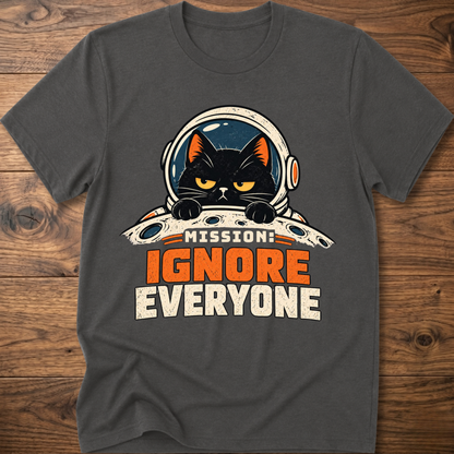 Charcoal T-shirt with cat astronaut 'Mission Ignore Everyone' graphic.
