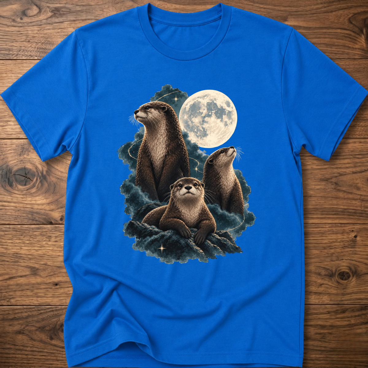 Royal blue t-shirt with moonlit otter graphic and teal waves on the chest