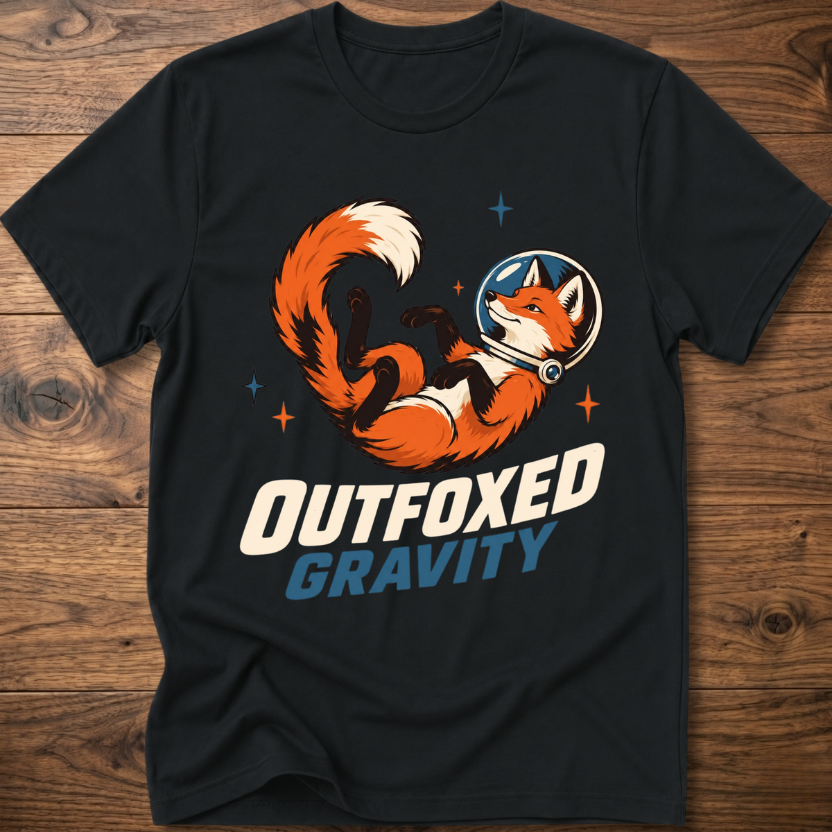 Outfoxed Gravity T-shirt in black with orange fox gravity graphic and logo text