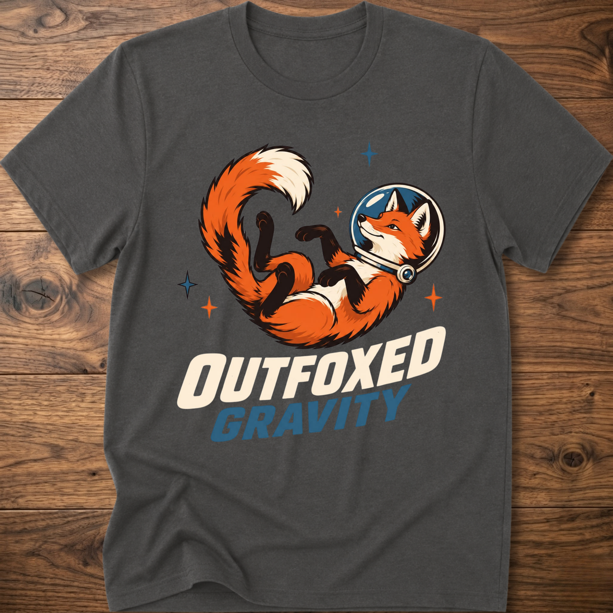 Outfoxed Gravity T-shirt in charcoal with orange fox gravity graphic and logo text