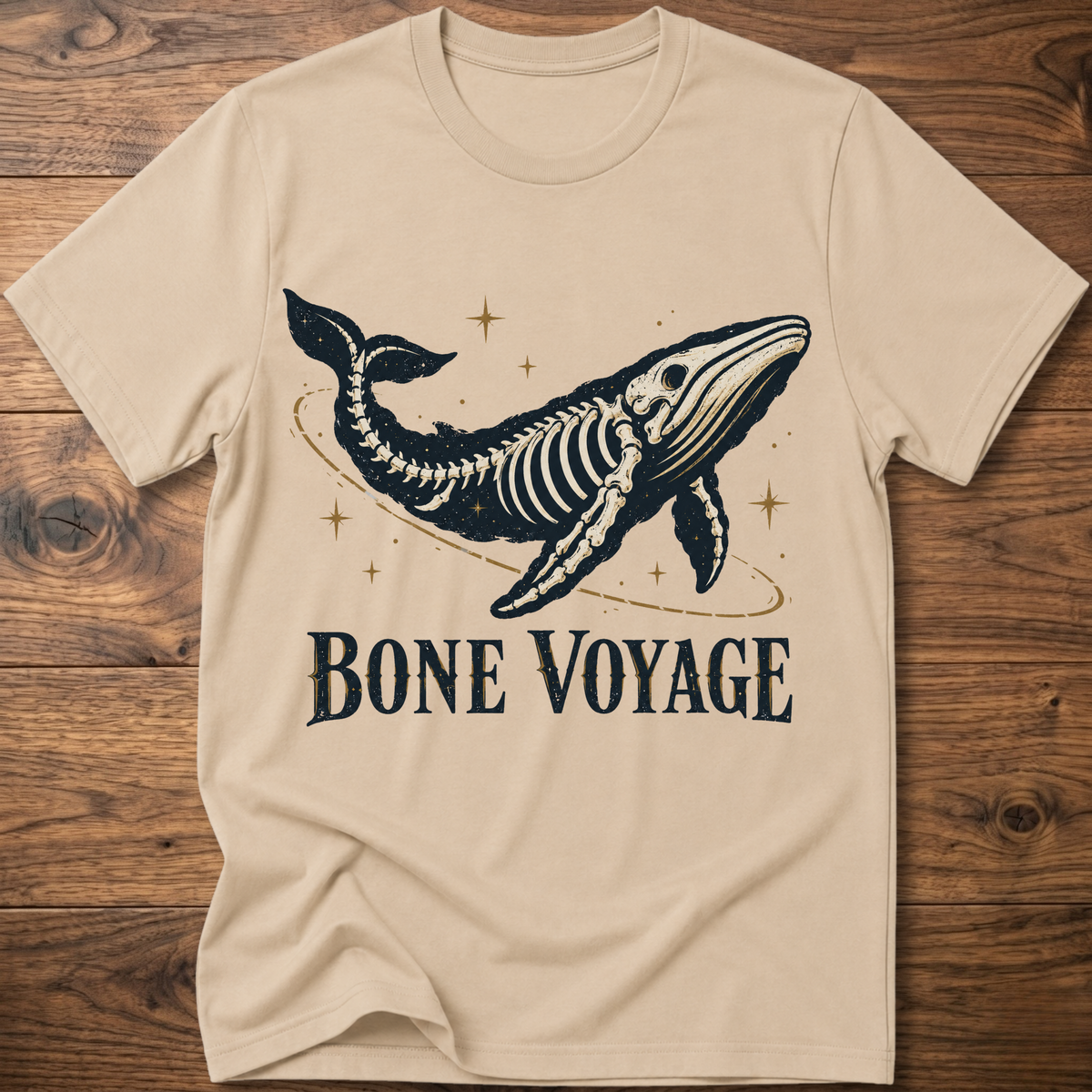 Sand whale graphic t-shirt with 'Bone Voyage' text and skeleton whale front print