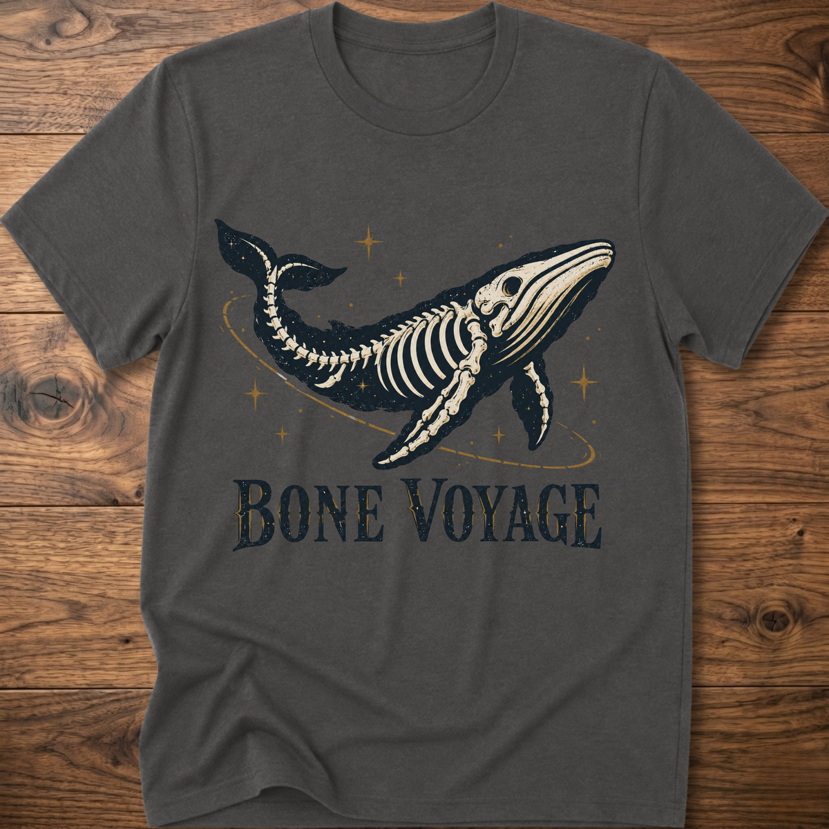 Charcoal whale graphic t-shirt with 'Bone Voyage' text and skeleton whale front print